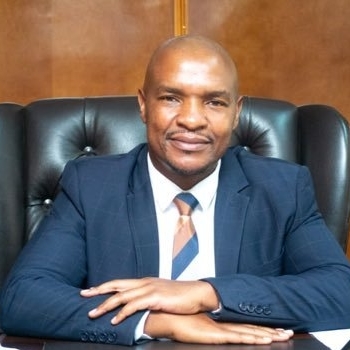 MINISTER, HON. FELIX T. MHONA, M.P.